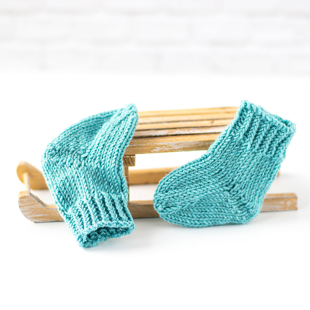 Puppensocken aus Wolle seegrün